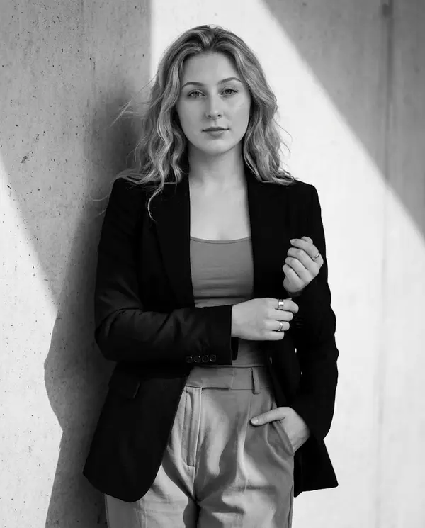 Monochrome Editorial Portrait Against Concrete
