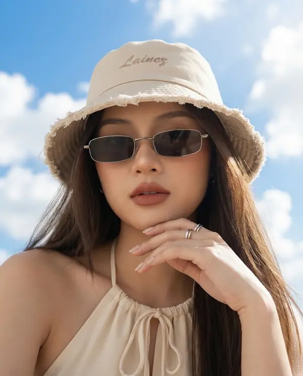 Young woman portrait bright blue sky sunlight