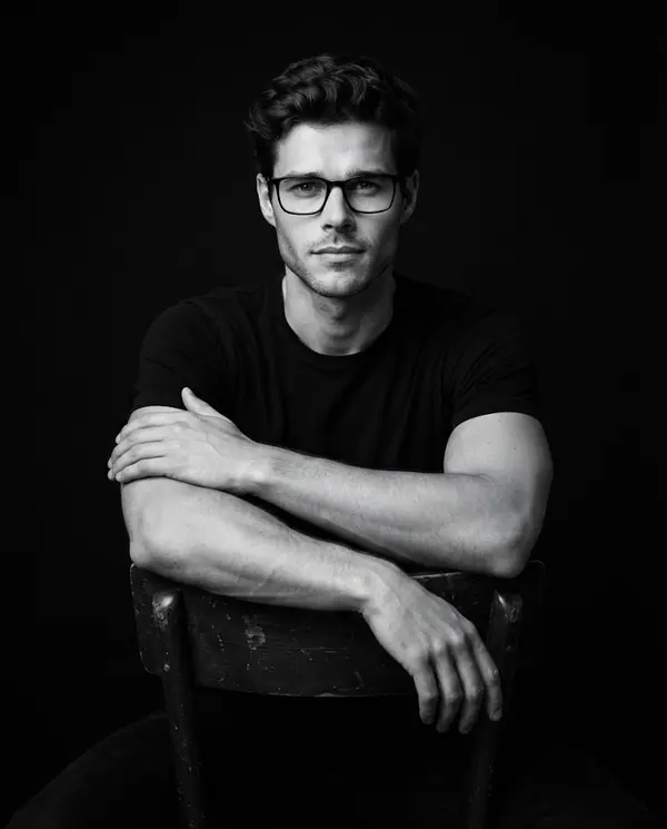 Professional black and white male portrait seated