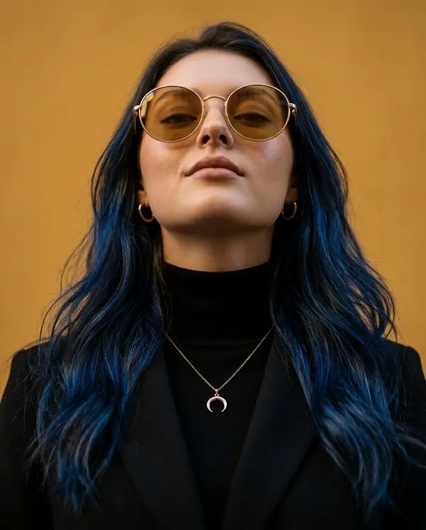 Fashion portrait with blue highlights and gold sunglasses