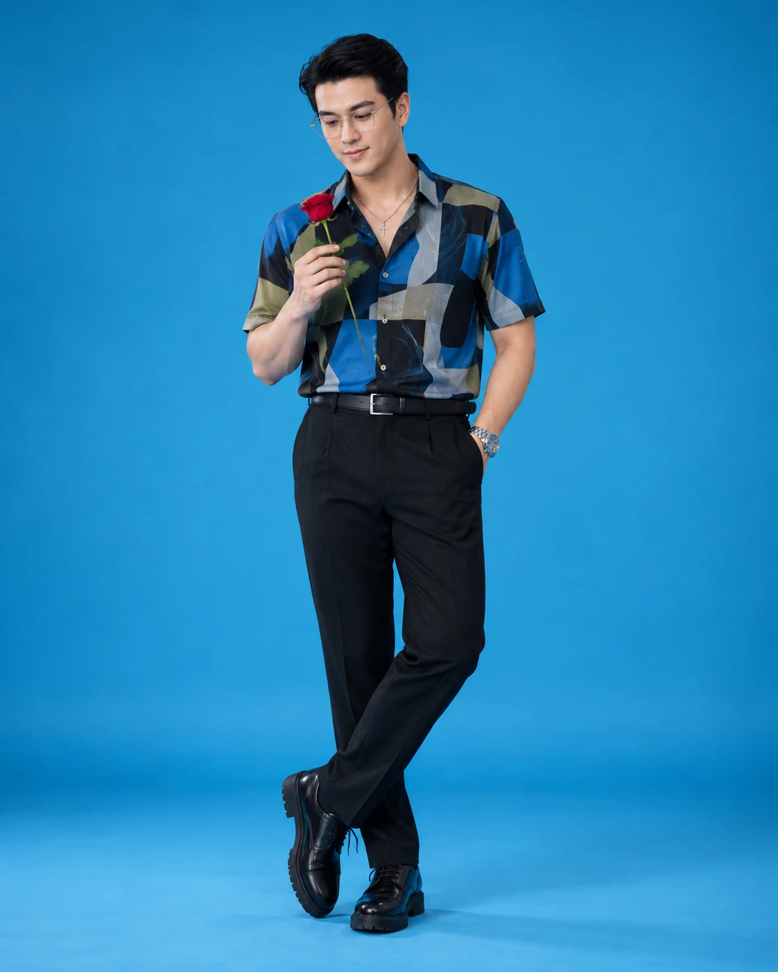 Stylish man studio portrait with cyan background image 1